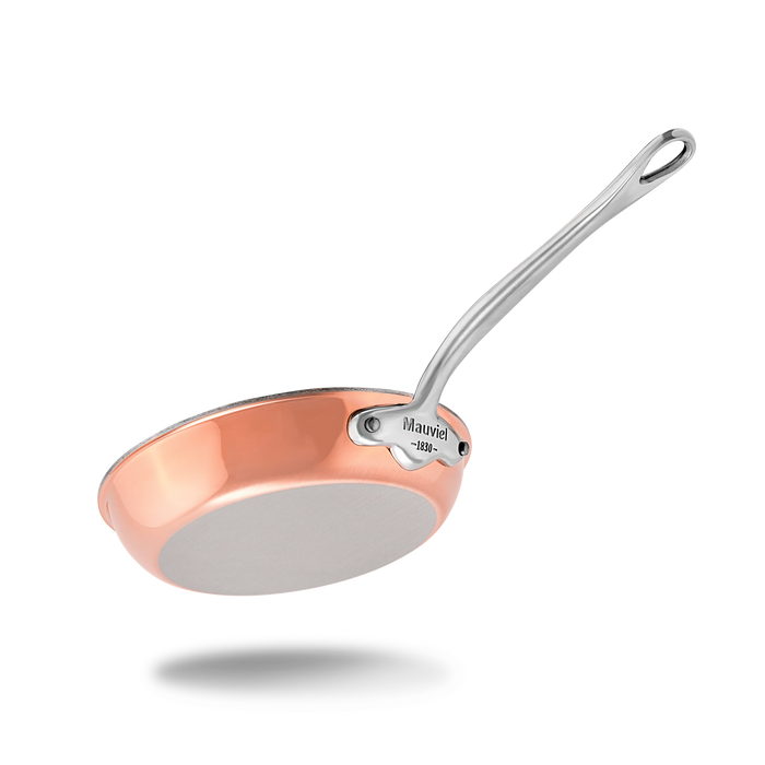 Mauviel M'6 S induction copper frying pan with cast stainless steel handle, showing the sleek copper surface and sturdy handle.