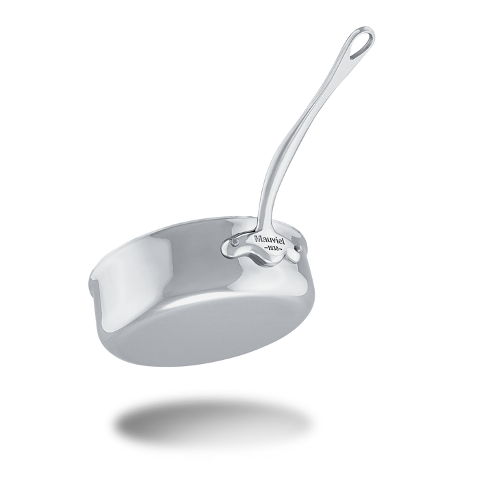 Mauviel M'COOK 5-ply stainless steel sauté pan with lid and cast stainless steel handle, shown with a shiny cooking surface