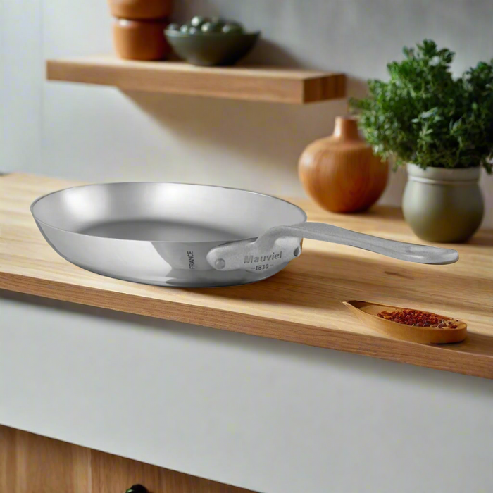 Mauviel M'Cook SB 5-Ply oval stainless steel frying pan with brushed handle, 13.5 x 9.1 inches, for versatile cooking.