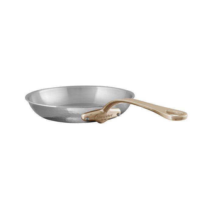 Mauviel M'ELITE B hammered 5-ply stainless steel frying pan with brass handle, shown with a smooth cooking surface and sturdy handle.