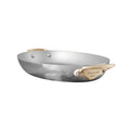 Mauviel M'ELITE B hammered 5-ply oval frying pan with brass handles, stainless steel cookware for professional kitchen use.