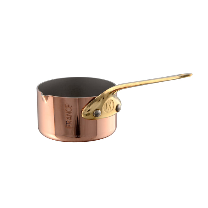 Mauviel M'MINIS copper sauce pan with brass handle and pouring spout, 2.7 inches, showcasing polished copper finish and sturdy design.