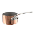 Mauviel M'MINIS copper sauce pan with stainless steel handles and pouring spout, 2-inch size, on a kitchen countertop