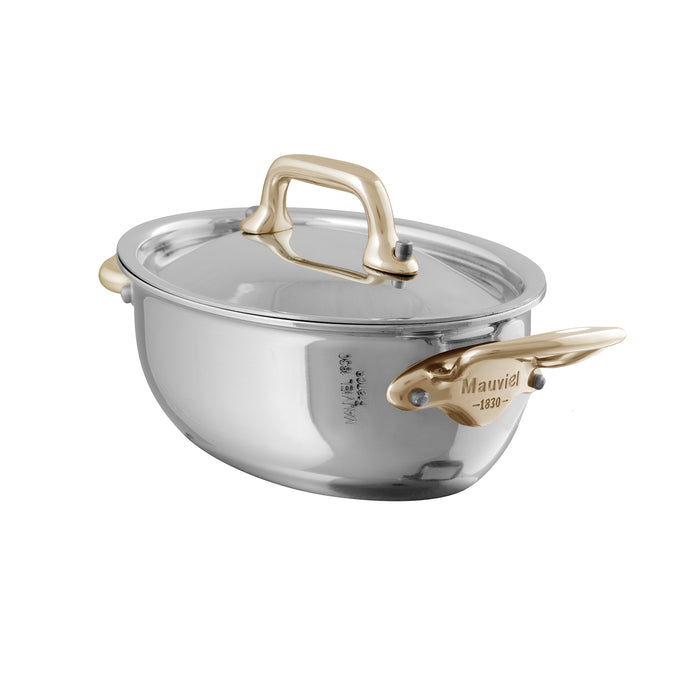 Mauviel M'MINIS stainless steel oval stewpan with brass handles and lid, 0.36-quart capacity, ideal for small stews and sauces.