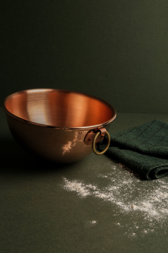 Mauviel M'PASSION egg white beating bowl with ring handle, stainless steel kitchen utensil for whipping and mixing ingredients.