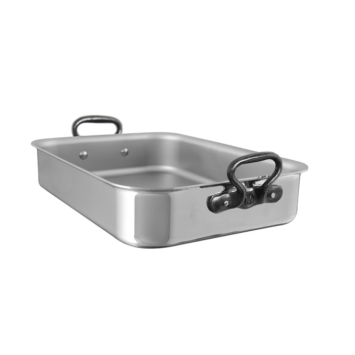 Mauviel stainless steel roasting pan with rack and cast iron handles, 15.7 inches, ideal for roasting meats and vegetables.